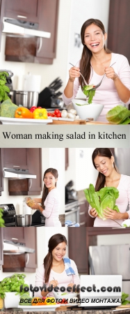Stock Photo: Woman making salad in kitchen