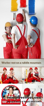  Stock Photo: Worker rest on a rubble mountain while fixing up a house