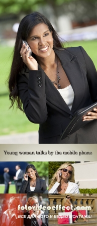 Stock Photo: Young woman talks by the mobile phone
