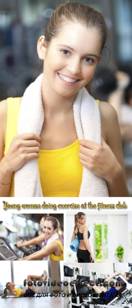 Stock Photo: Young woman doing exercise at the fitness club