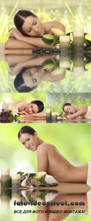 Stock Photo: Woman relaxing in spa, with reflection on the water