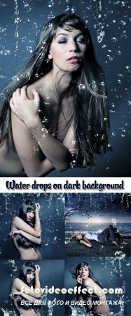 Stock Photo: Young woman in water drops on dark background