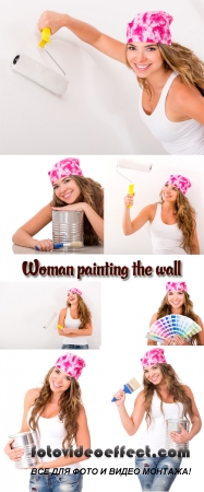 Stock Photo: Woman painting the wall
