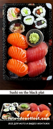 Stock Photo: Sushi on the black plat