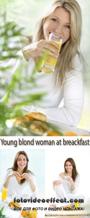Stock Photo: Young blond woman at breakfast