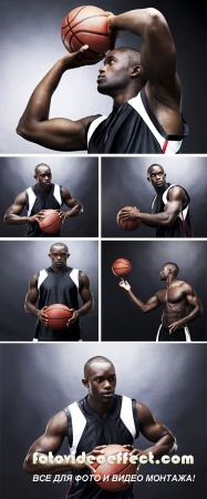 Stock Photo: Basketball player standing confidently