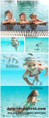 Children swim in the pool /     - Photo stock