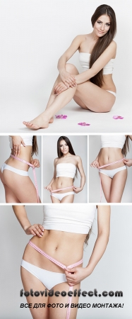 Stock Photo: Dieting. Young woman measuring waist