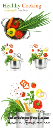 Stock Photo: Fresh vegetables falling into a stainless