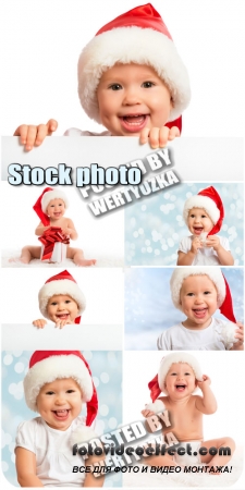     / Kid in Santa hats - stock photos