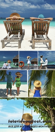 Stock Photo: Couple in green on a beach at Maldives
